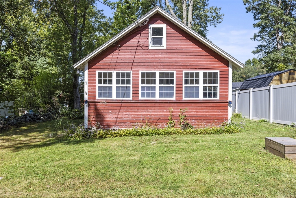 7 Sichols Colony Road Wales, MA 01081 - Photo 18 of 29 a front view of a house with a yard and porch