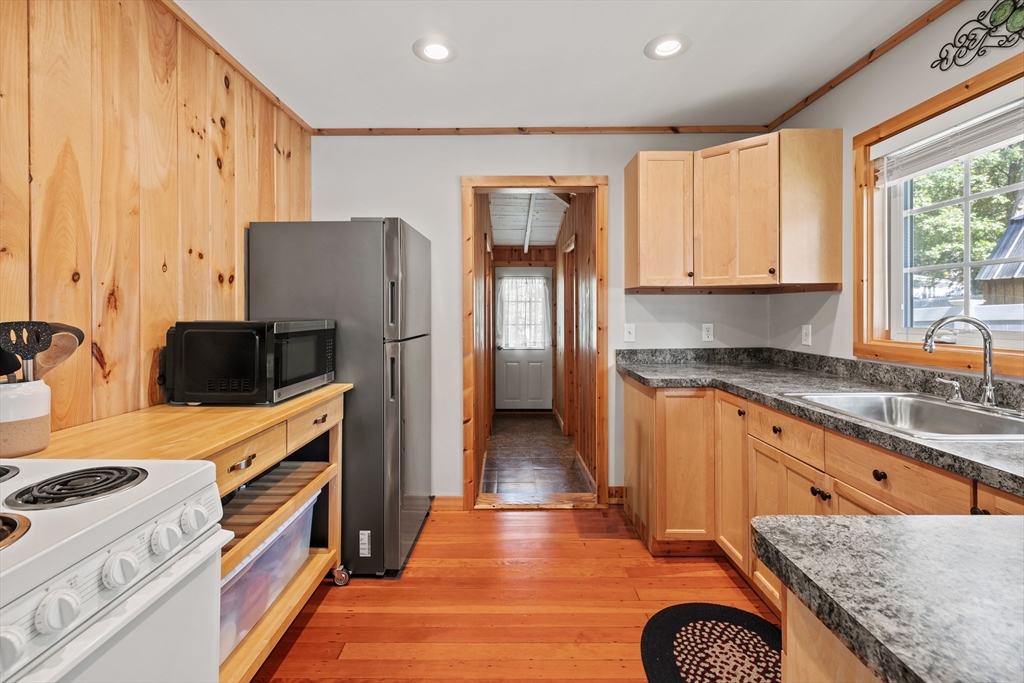 7 Sichols Colony Road Wales, MA 01081 - Photo 2 of 29 a kitchen with stainless steel appliances granite countertop a refrigerator and a stove top oven