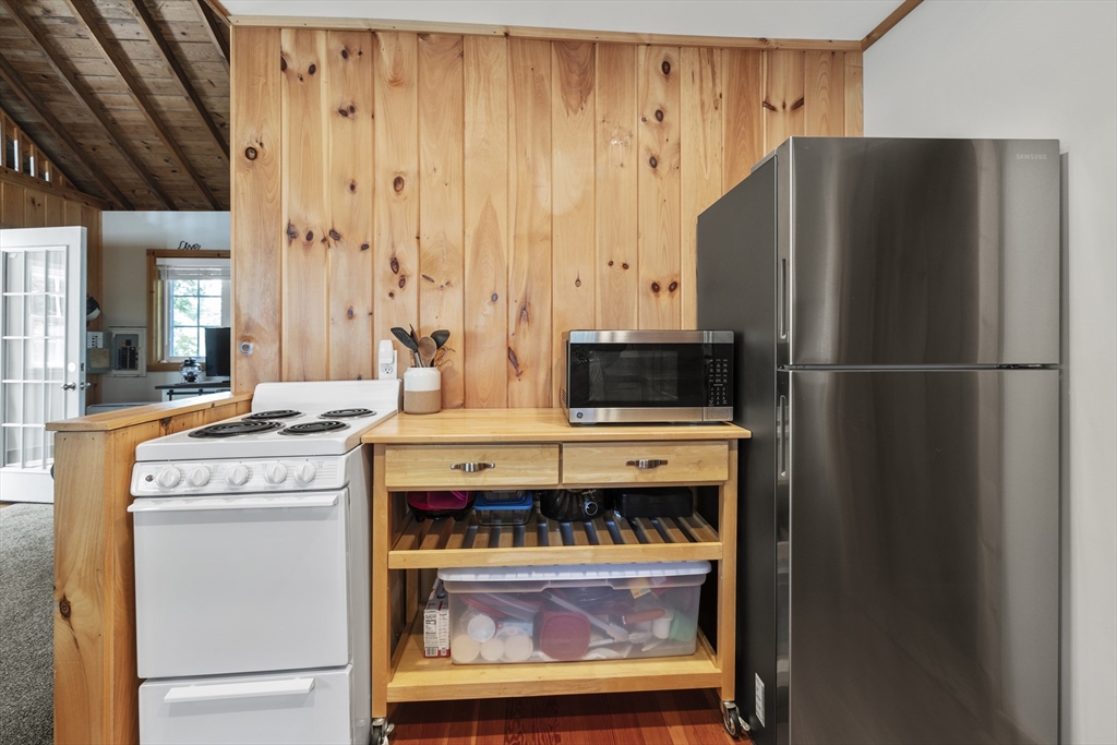 7 Sichols Colony Road Wales, MA 01081 - Photo 4 of 29 a kitchen with a stove and a refrigerator