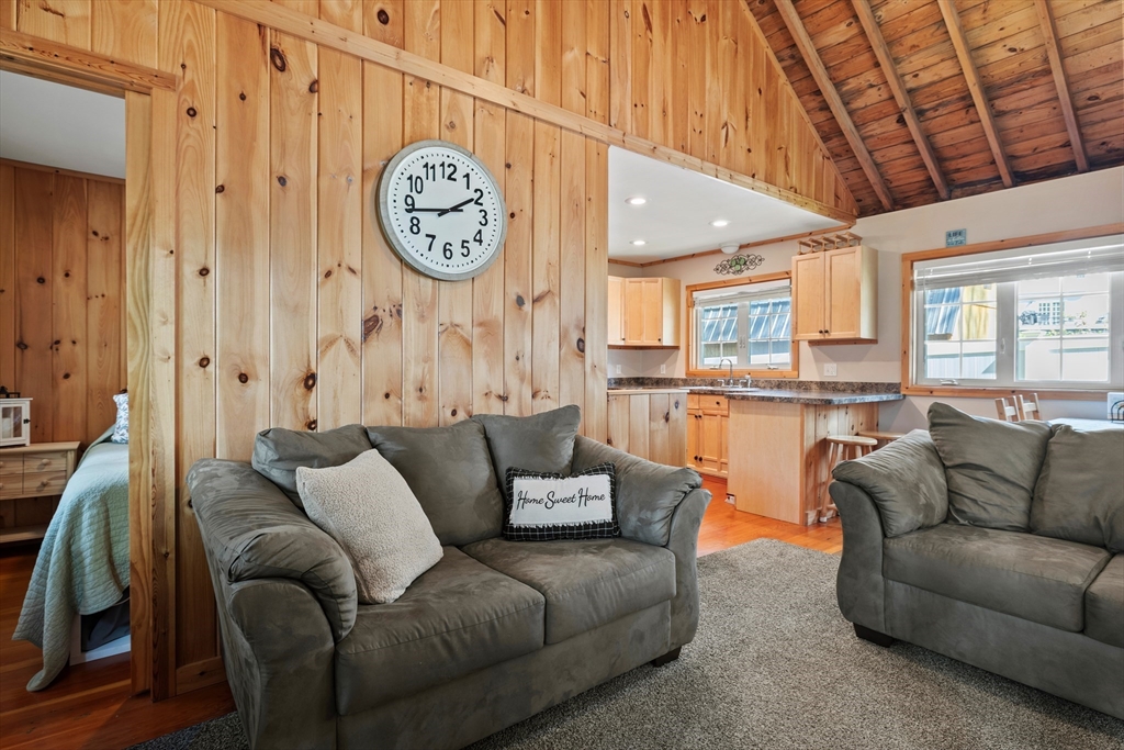 7 Sichols Colony Road Wales, MA 01081 - Photo 6 of 29 a living room with furniture a clock and a view of kitchen