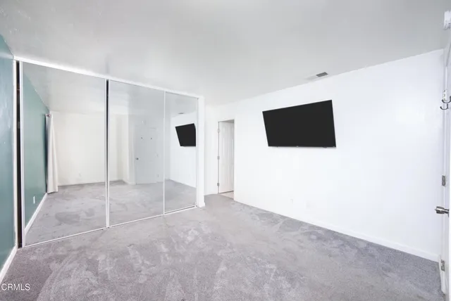 a view of a livingroom with a flat screen tv