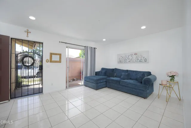 a living room with furniture and a gate
