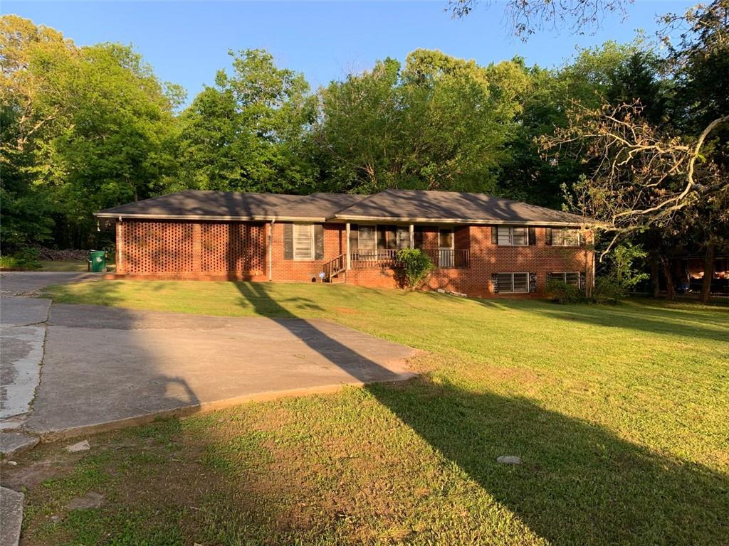 3138 Wesley Chapel Road Decatur, GA 30034 - Photo 1 of 1 a view of house with swimming pool