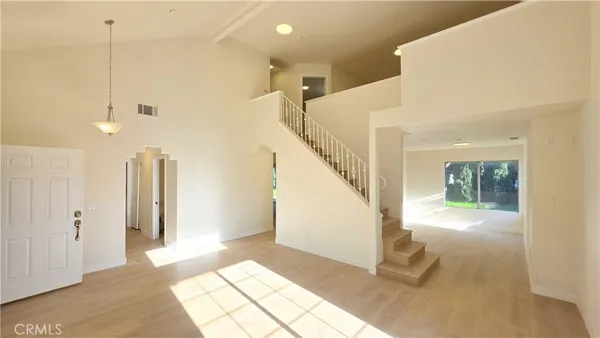 a view of entryway with wooden floor and a rug