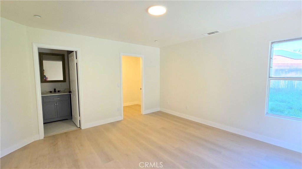 1116 Cloverdale Street Riverside, CA 92501 - Photo 12 of 29 an empty room with closet and a window