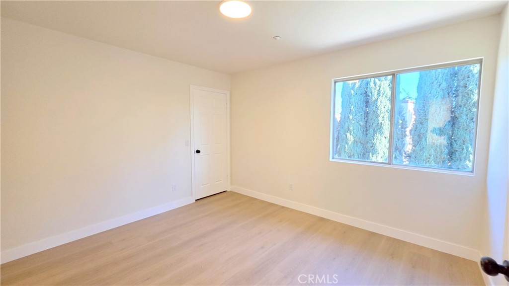 1116 Cloverdale Street Riverside, CA 92501 - Photo 19 of 29 an empty room with a window