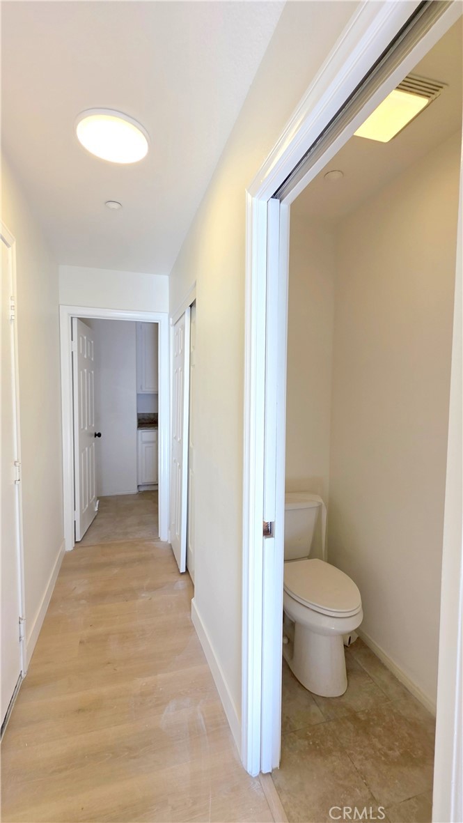 1116 Cloverdale Street Riverside, CA 92501 - Photo 24 of 29 a bathroom with a toilet and a shower