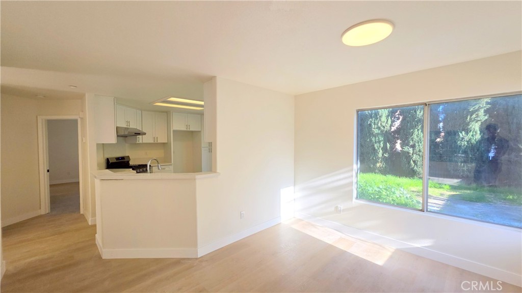 1116 Cloverdale Street Riverside, CA 92501 - Photo 6 of 29 a kitchen view with a refrigerator and a stove