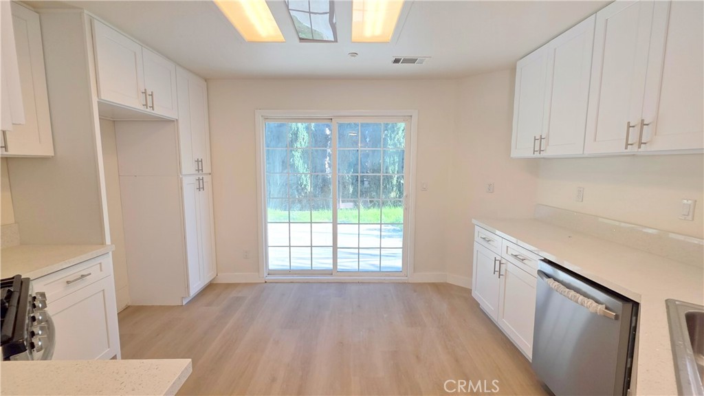 1116 Cloverdale Street Riverside, CA 92501 - Photo 8 of 29 a view of a kitchen with electric appliances