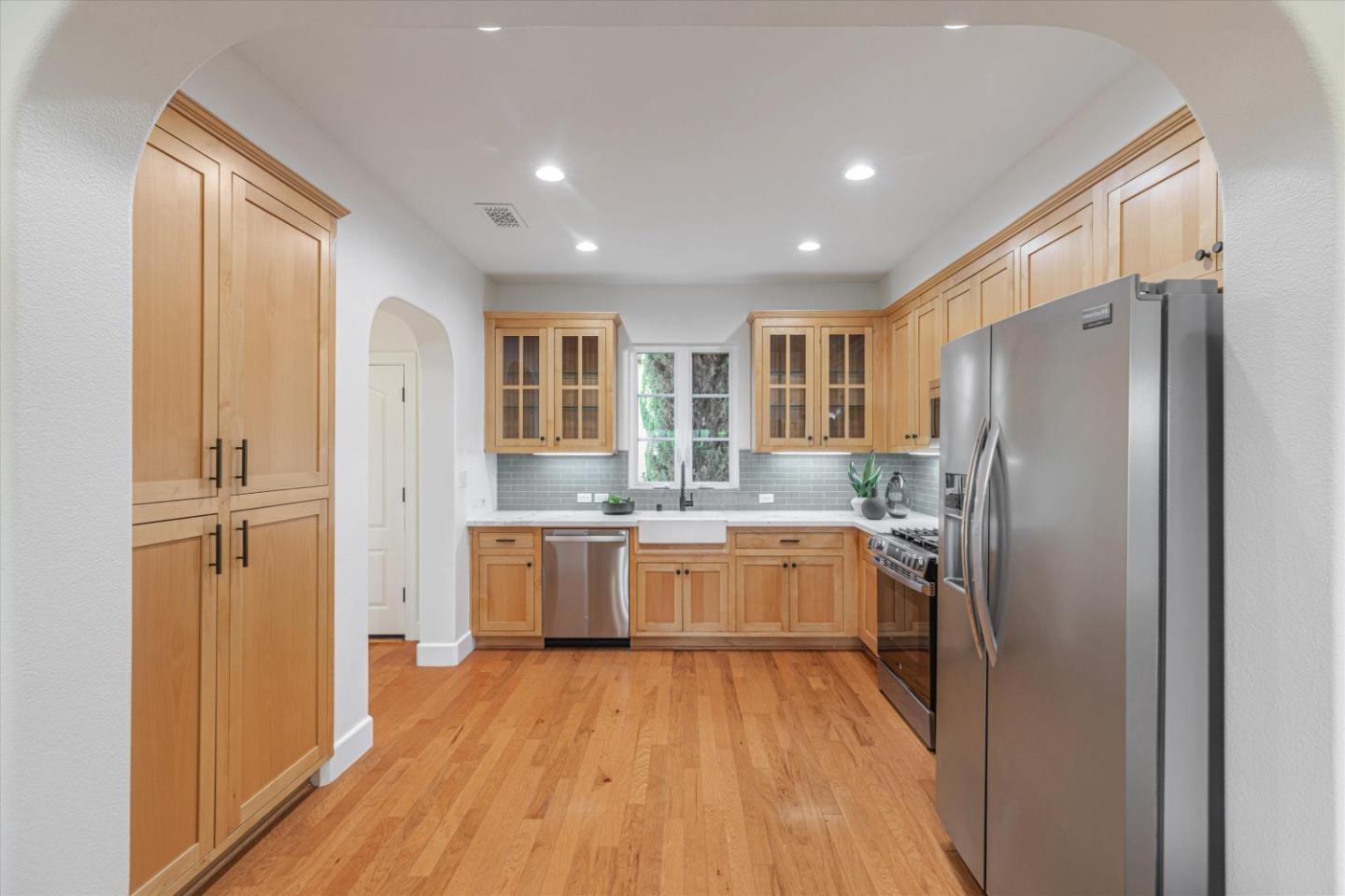 1382 Dahlia Loop San Jose, CA 95126 - Photo 11 of 31 a kitchen with stainless steel appliances granite countertop a refrigerator and a stove top oven