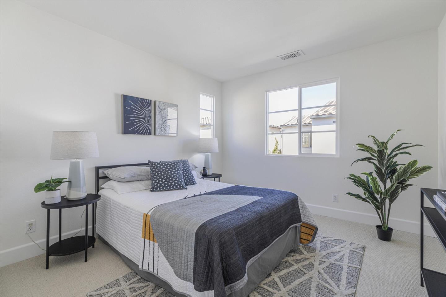 1382 Dahlia Loop San Jose, CA 95126 - Photo 17 of 31 a bedroom with a bed and a potted plant
