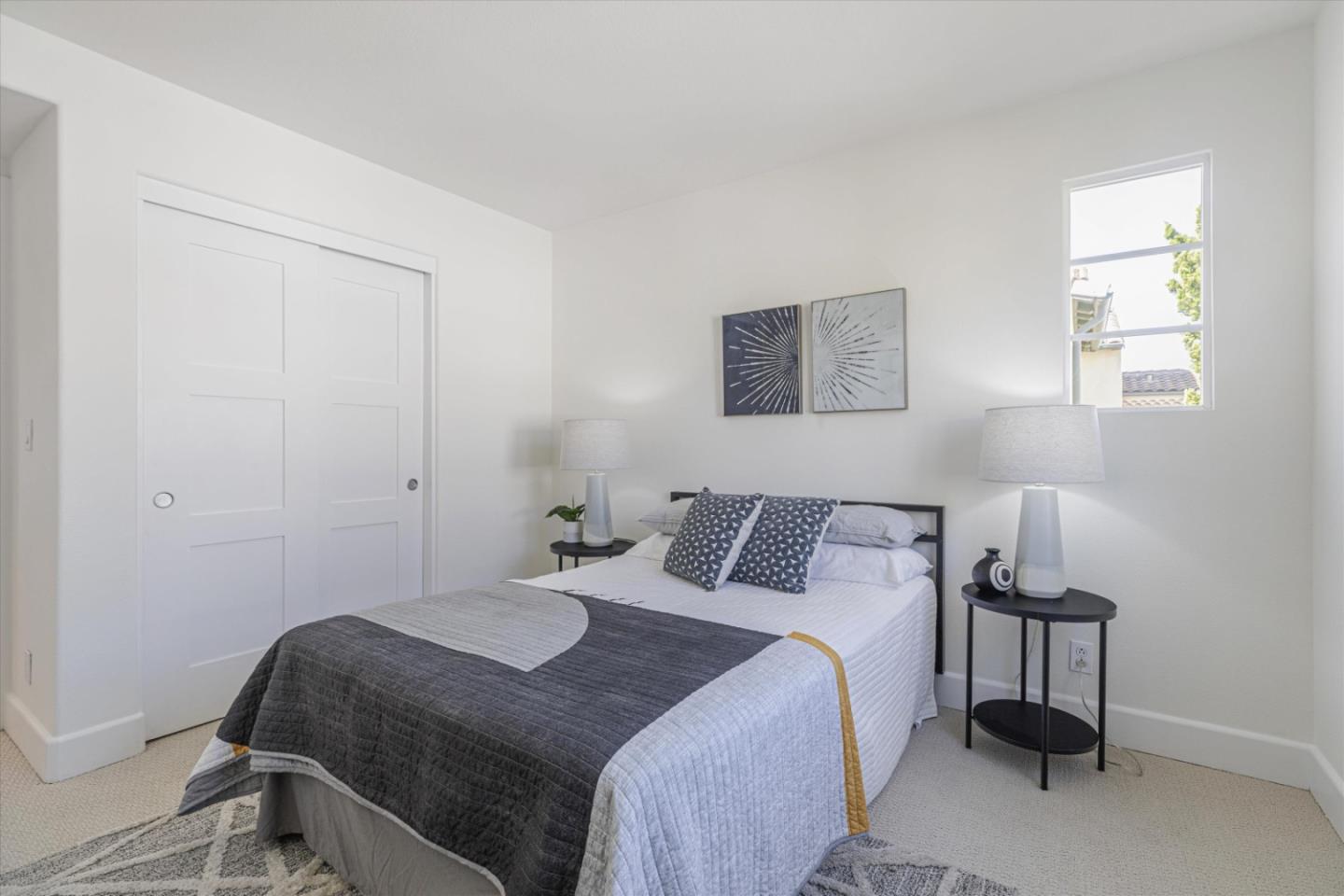 1382 Dahlia Loop San Jose, CA 95126 - Photo 18 of 31 a bedroom with a bed and a table in it