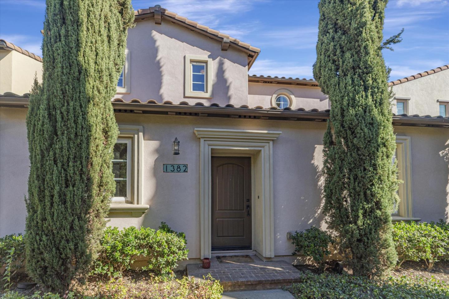 1382 Dahlia Loop San Jose, CA 95126 - Photo 2 of 31 a front view of a house with a garden