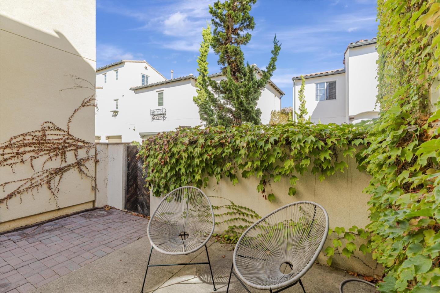 1382 Dahlia Loop San Jose, CA 95126 - Photo 23 of 31 a backyard of a house with table and chairs