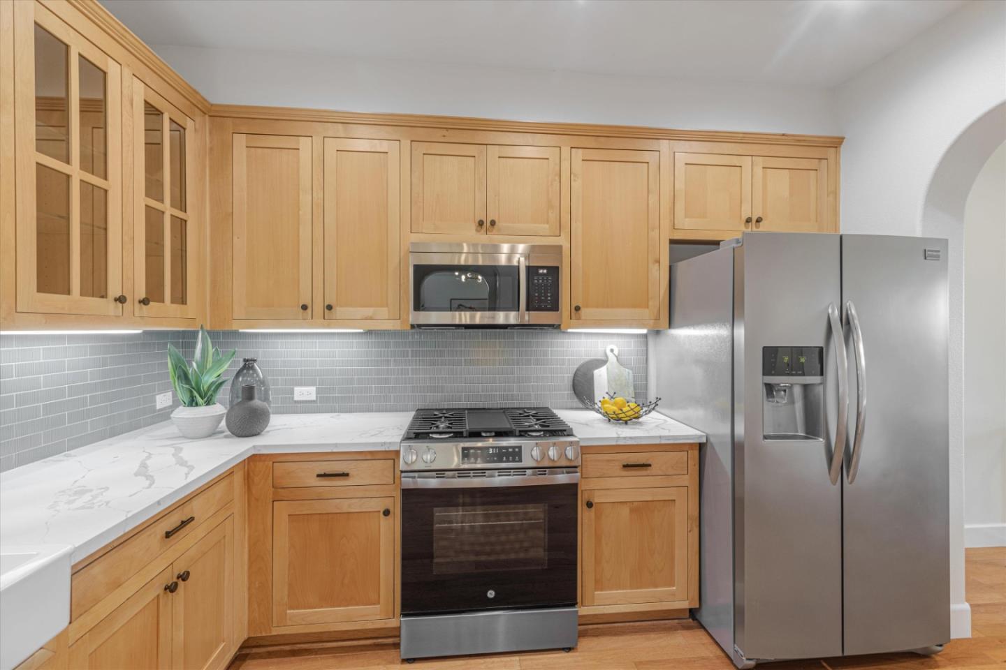1382 Dahlia Loop San Jose, CA 95126 - Photo 9 of 31 a kitchen with stainless steel appliances a stove microwave and refrigerator