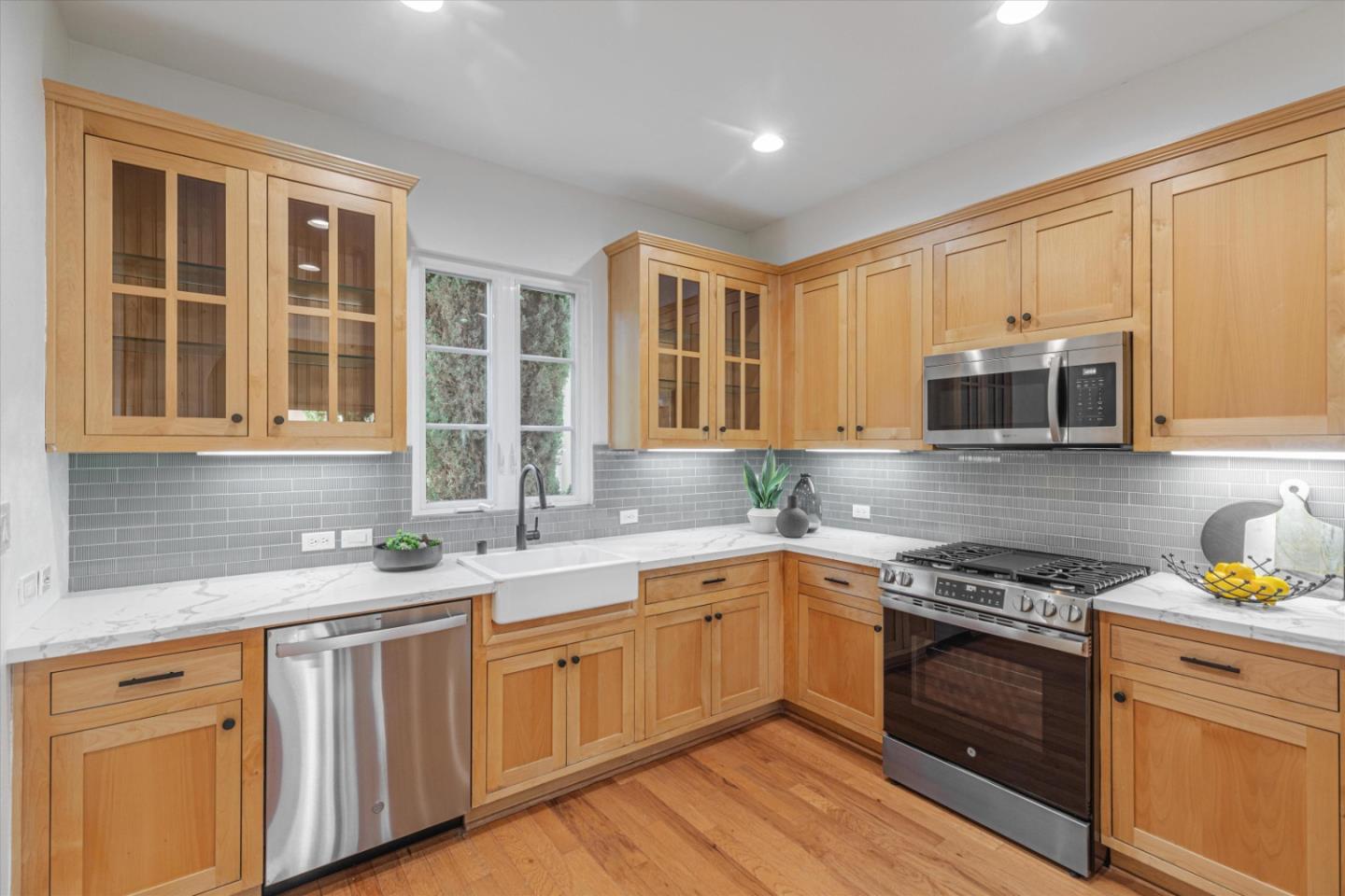 1382 Dahlia Loop San Jose, CA 95126 - Photo 10 of 31 a kitchen with stainless steel appliances granite countertop a sink stove and microwave