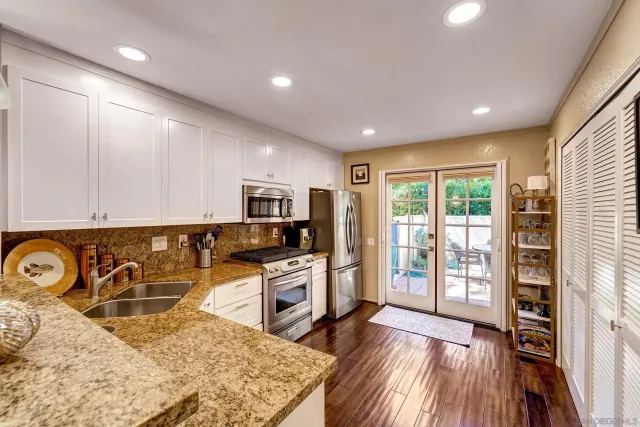 a view of a kitchen with microwave and stove