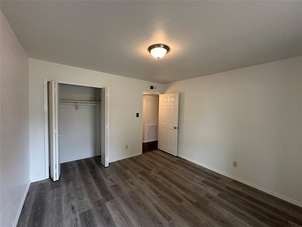 910 Sunny Slope Drive Allen, TX 75002 - Photo 14 of 27 a view of hallway with wooden floor