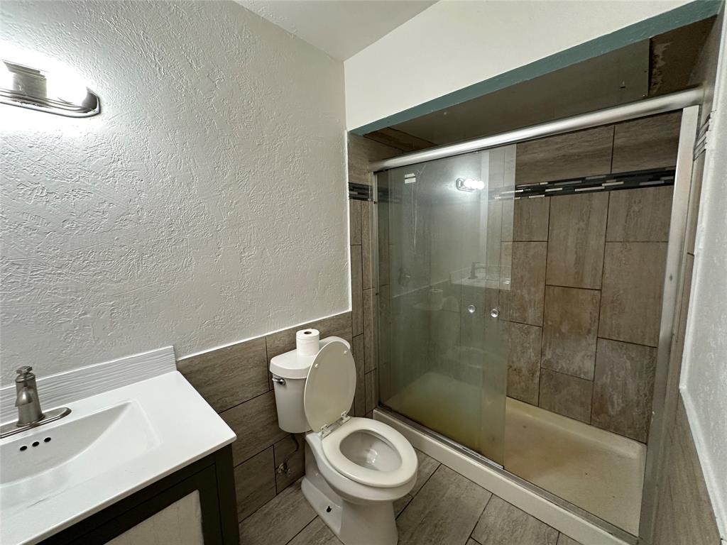 910 Sunny Slope Drive Allen, TX 75002 - Photo 20 of 27 a bathroom with a sink and a toilet