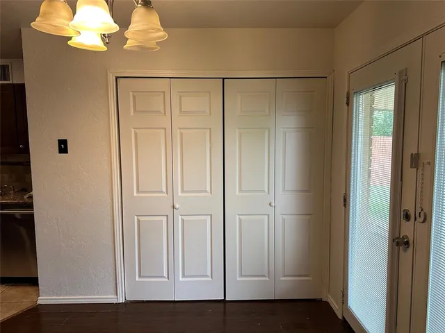 an empty room with wooden floor