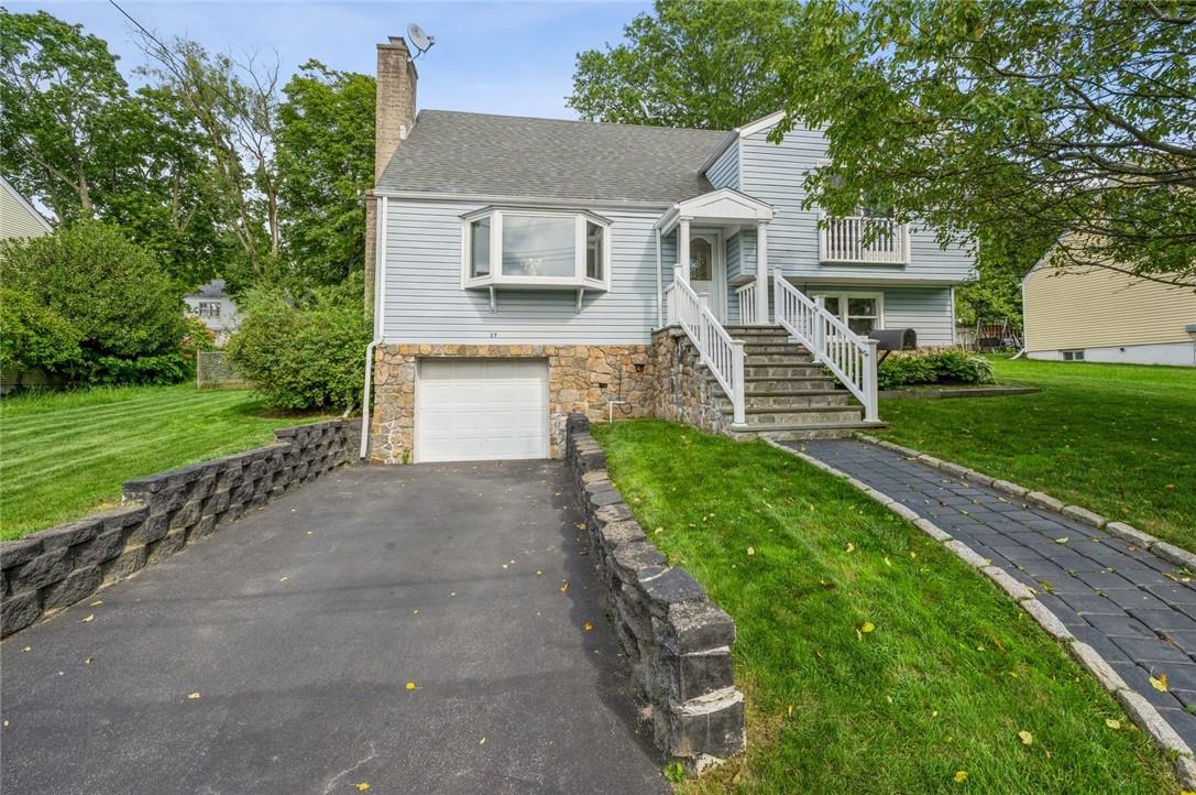 27 Goodwin Avenue White Plains, NY 10607 - Photo 1 of 1 a front view of a house with a yard and garage
