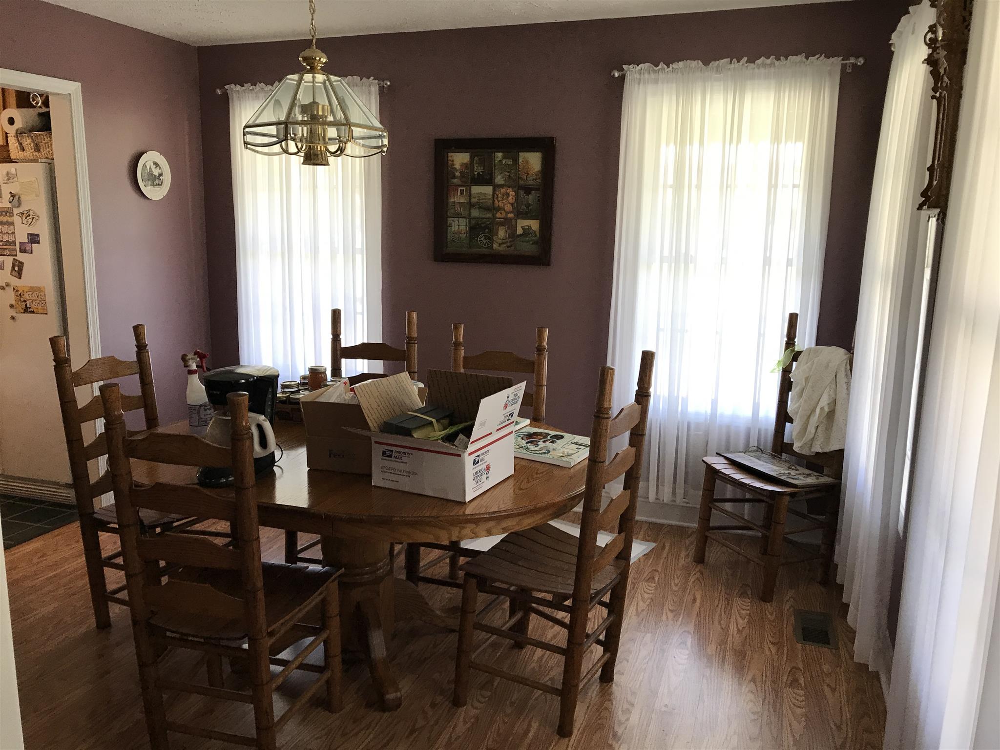 117 Hunt Creek Road Manchester, TN 37355 - Photo 11 of 18 a dining room with furniture a chandelier and wooden floor