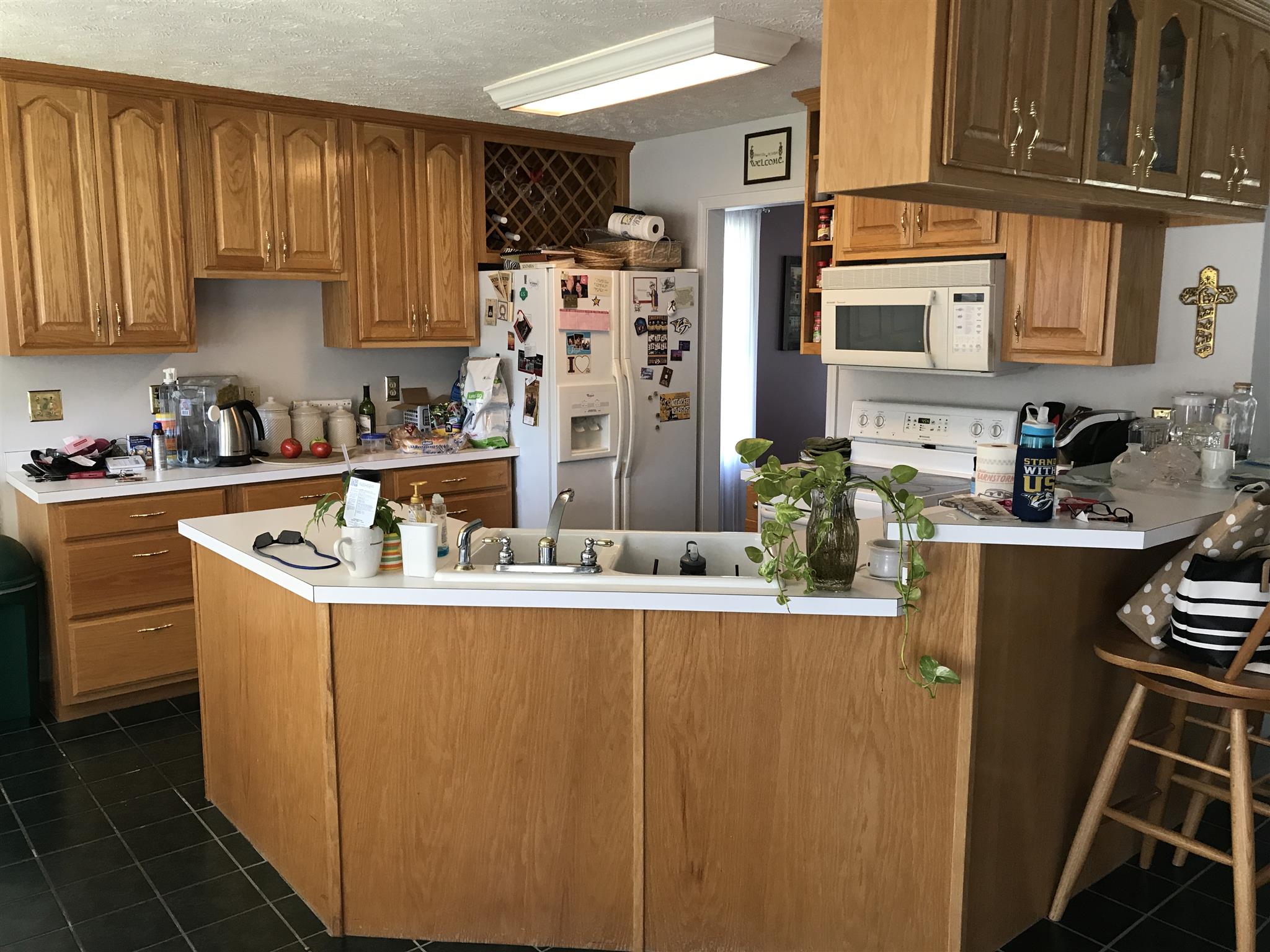 117 Hunt Creek Road Manchester, TN 37355 - Photo 12 of 18 a kitchen with stainless steel appliances granite countertop a refrigerator a stove a sink dishwasher and cabinets with wooden floor