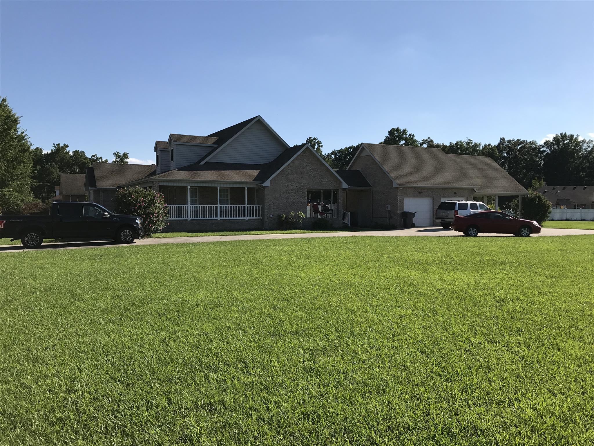 117 Hunt Creek Road Manchester, TN 37355 - Photo 3 of 18 a view of a house with a big yard and large trees