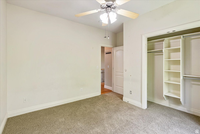 316 Azure Circle Draper, UT 84020 - Photo 25 of 48 Room featuring neutral carpeting, a ceiling fan with light fixture, and a built-in closet organization system with shelving and hanging rods