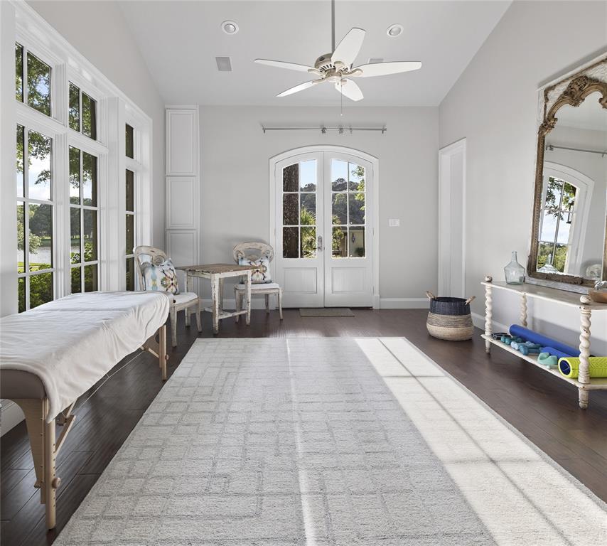 3920 Smelley Road Longview, TX 75605 - Photo 15 of 35 a spacious bedroom with a large bed and a chandelier