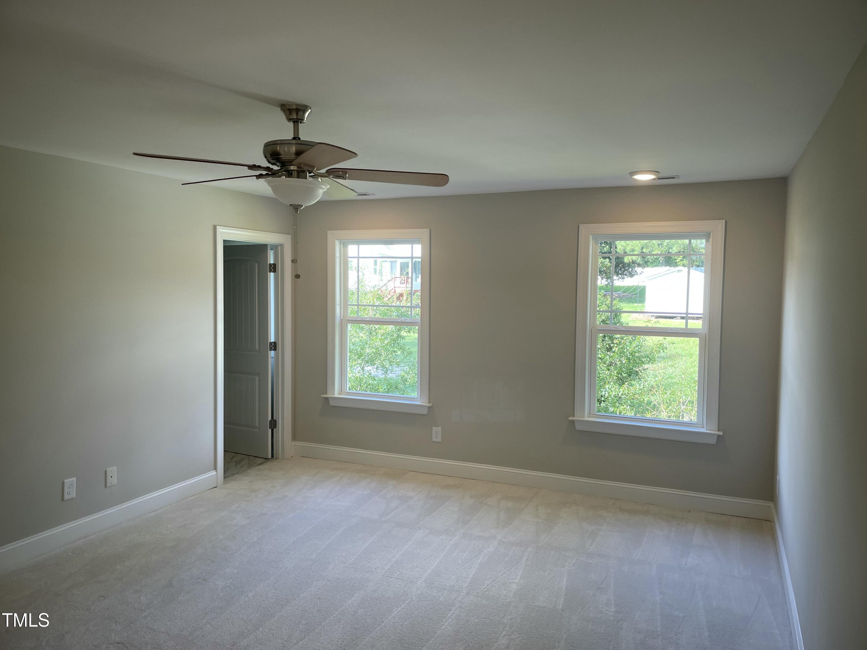 5500 Batoul Lane Raleigh, NC 27606 - Photo 19 of 32 a view of an empty room with a window