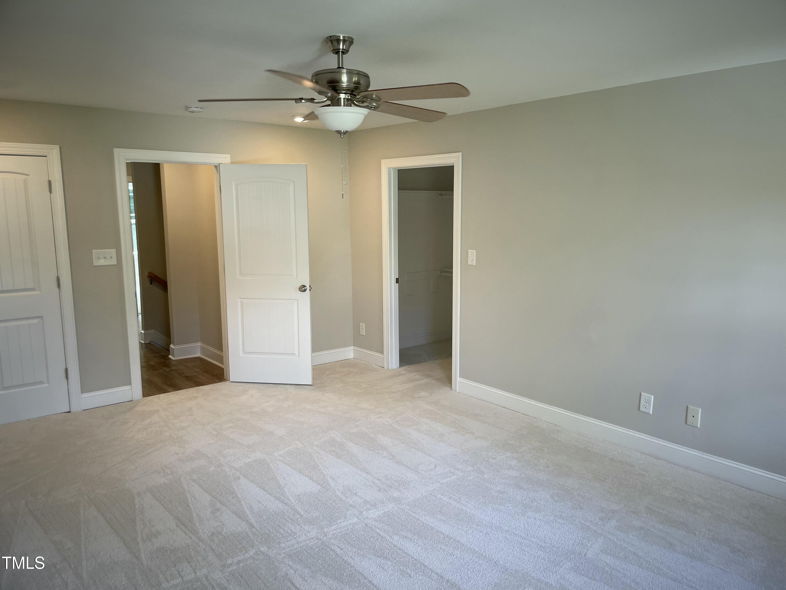5500 Batoul Lane Raleigh, NC 27606 - Photo 20 of 32 a view of a livingroom with a chandelier fan