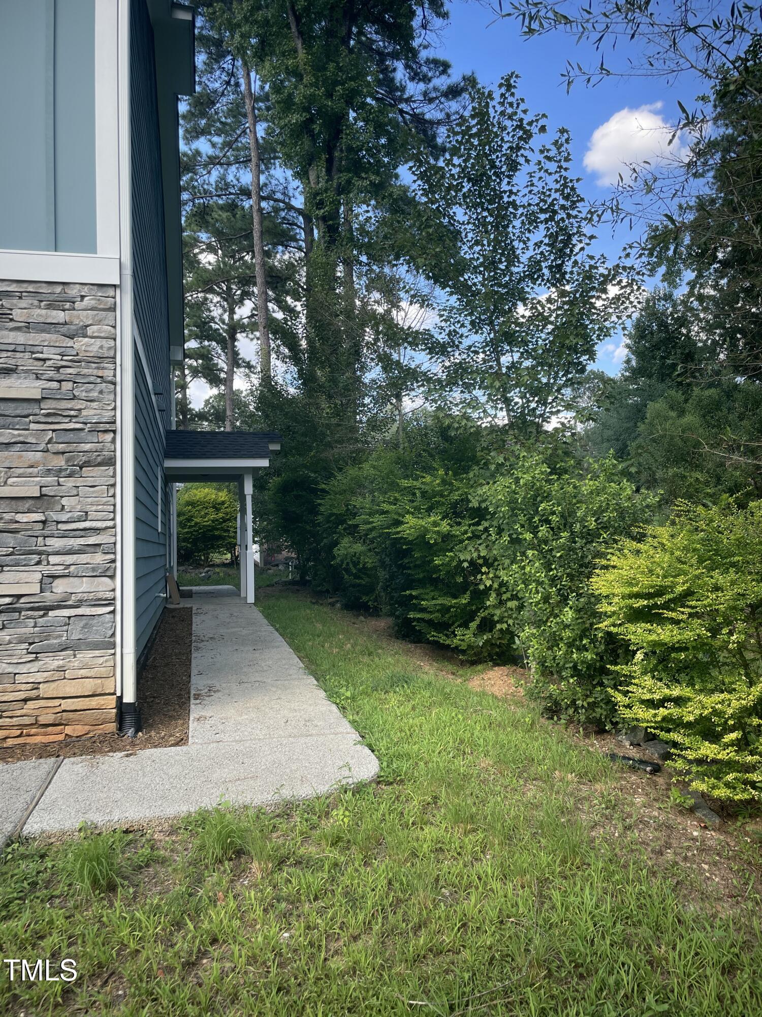 5500 Batoul Lane Raleigh, NC 27606 - Photo 2 of 32 front view of a house with a yard and potted plants