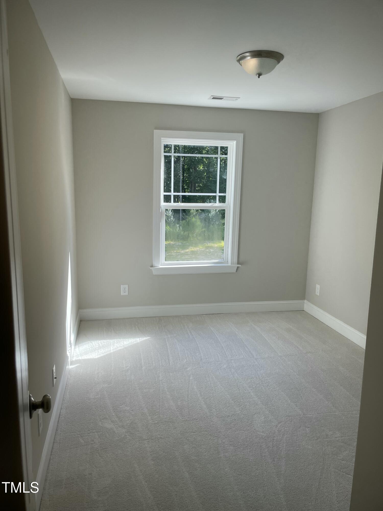 5500 Batoul Lane Raleigh, NC 27606 - Photo 28 of 32 an empty room with a window