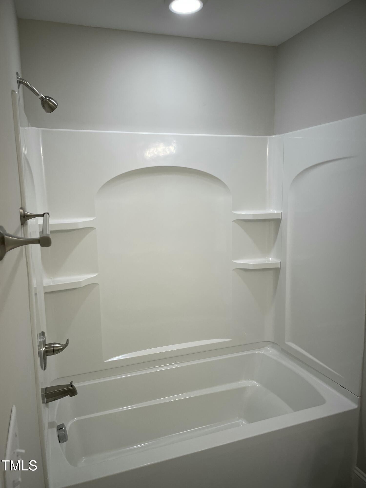 5500 Batoul Lane Raleigh, NC 27606 - Photo 31 of 32 a bathroom with a bathtub