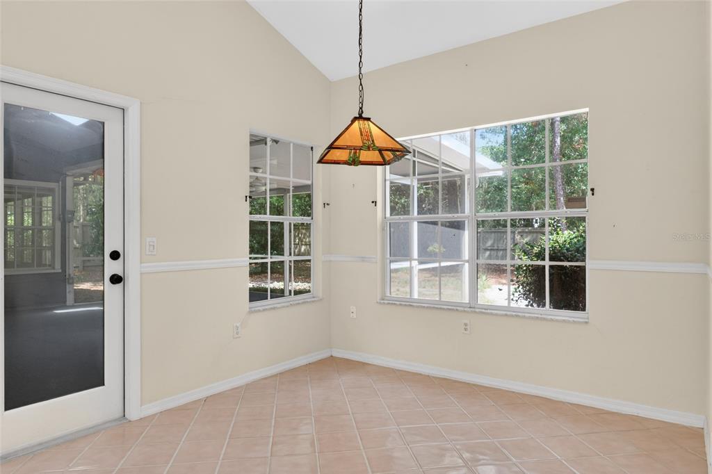 9626 Southwest 53rd Road Gainesville, FL 32608 - Photo 9 of 23 a room that has a window and wooden floor