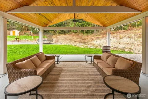 a balcony with furniture and a garden