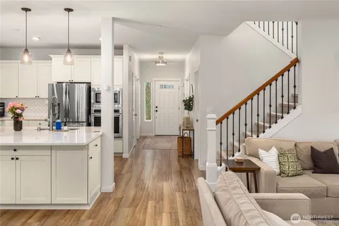 a living room with furniture and a table