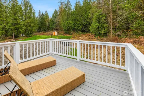 a view of a two chairs in the balcony