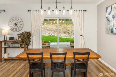 a dining room with furniture and window