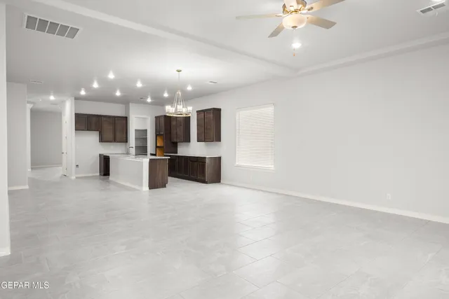 a view of a kitchen with a sink and a stove top oven