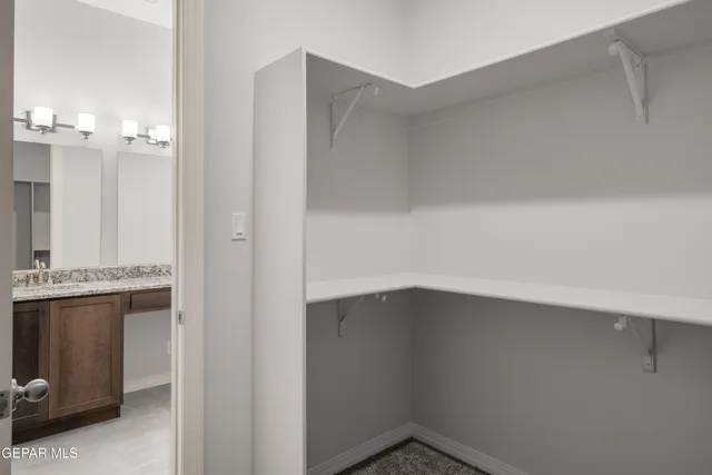 a room with cabinets and a stove