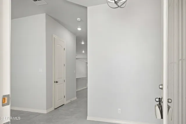 a bathroom with a shower and mirror