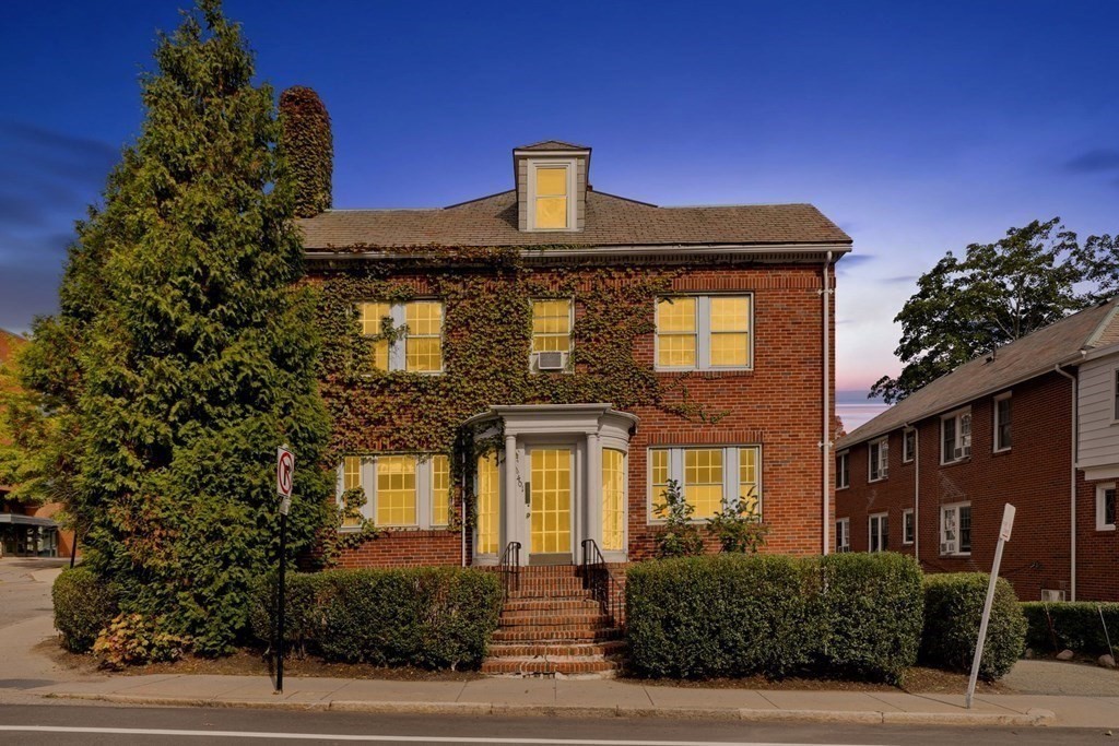 3 Clark Road Brookline, MA 02445 - Photo 1 of 24 a front view of a house with garden
