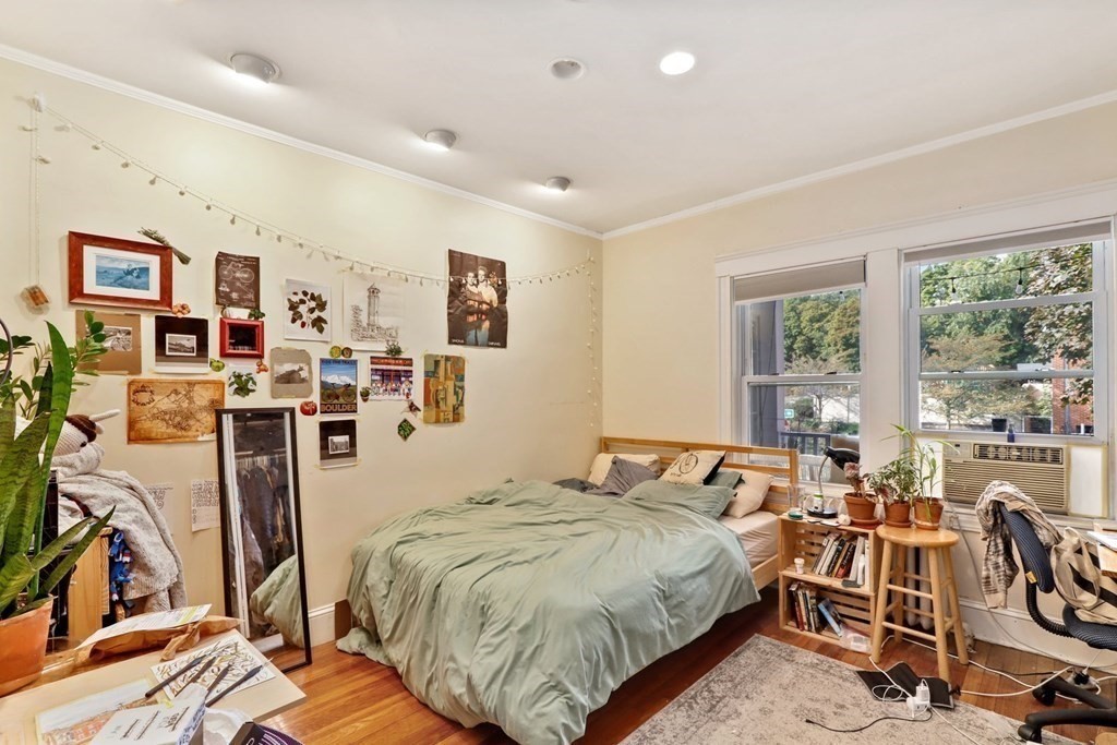 3 Clark Road Brookline, MA 02445 - Photo 11 of 24 a bed room with a bed and glass door