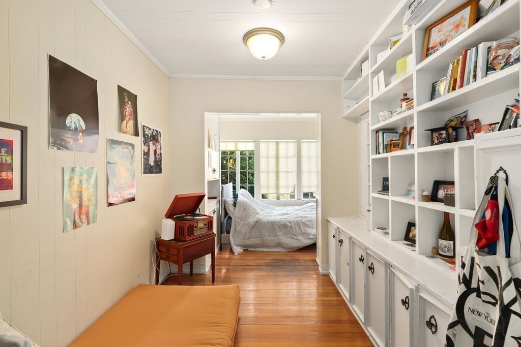 3 Clark Road Brookline, MA 02445 - Photo 12 of 24 a room with furniture a rug and a book shelf