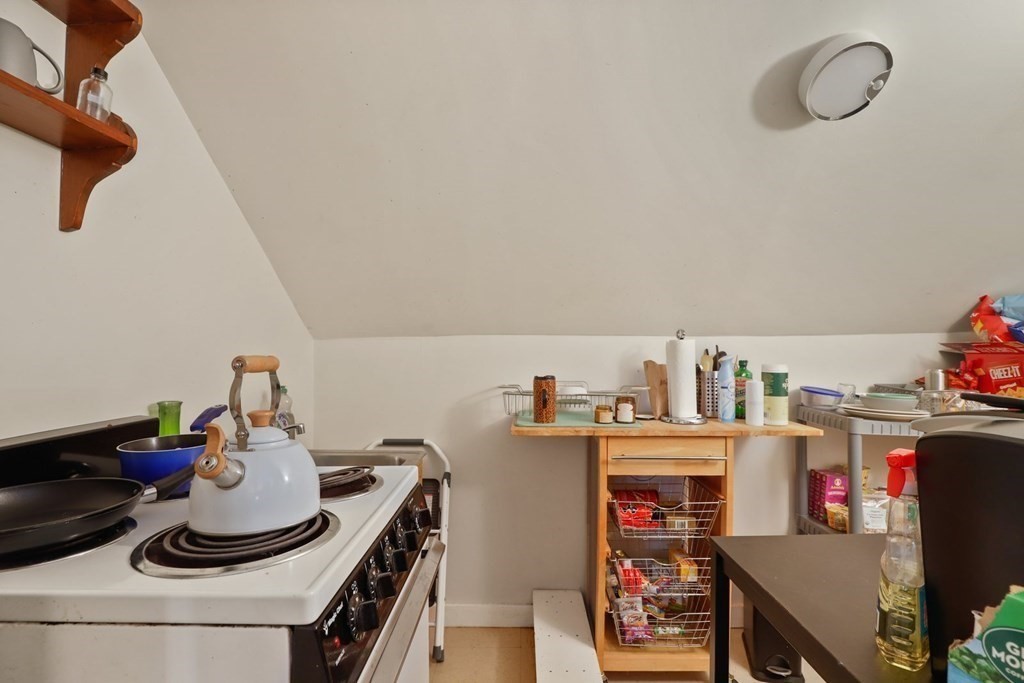 3 Clark Road Brookline, MA 02445 - Photo 18 of 24 a room with furniture and a book shelf