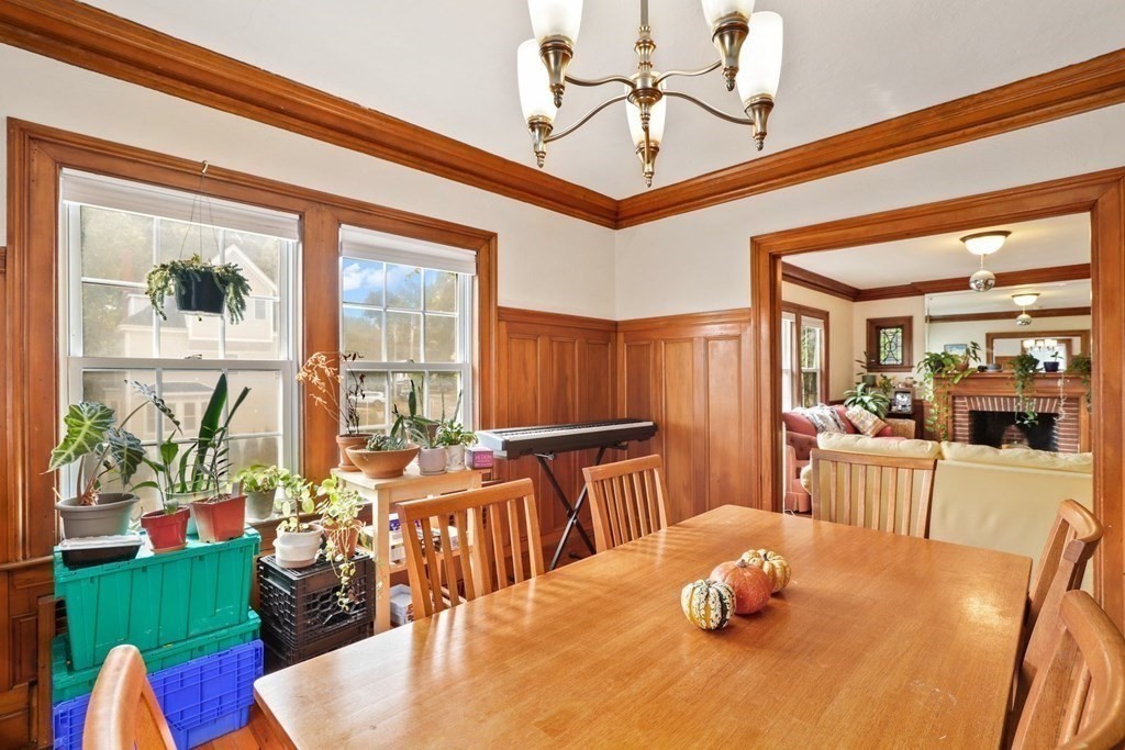 3 Clark Road Brookline, MA 02445 - Photo 5 of 24 a view of a dining room with furniture wooden floor and a chandelier