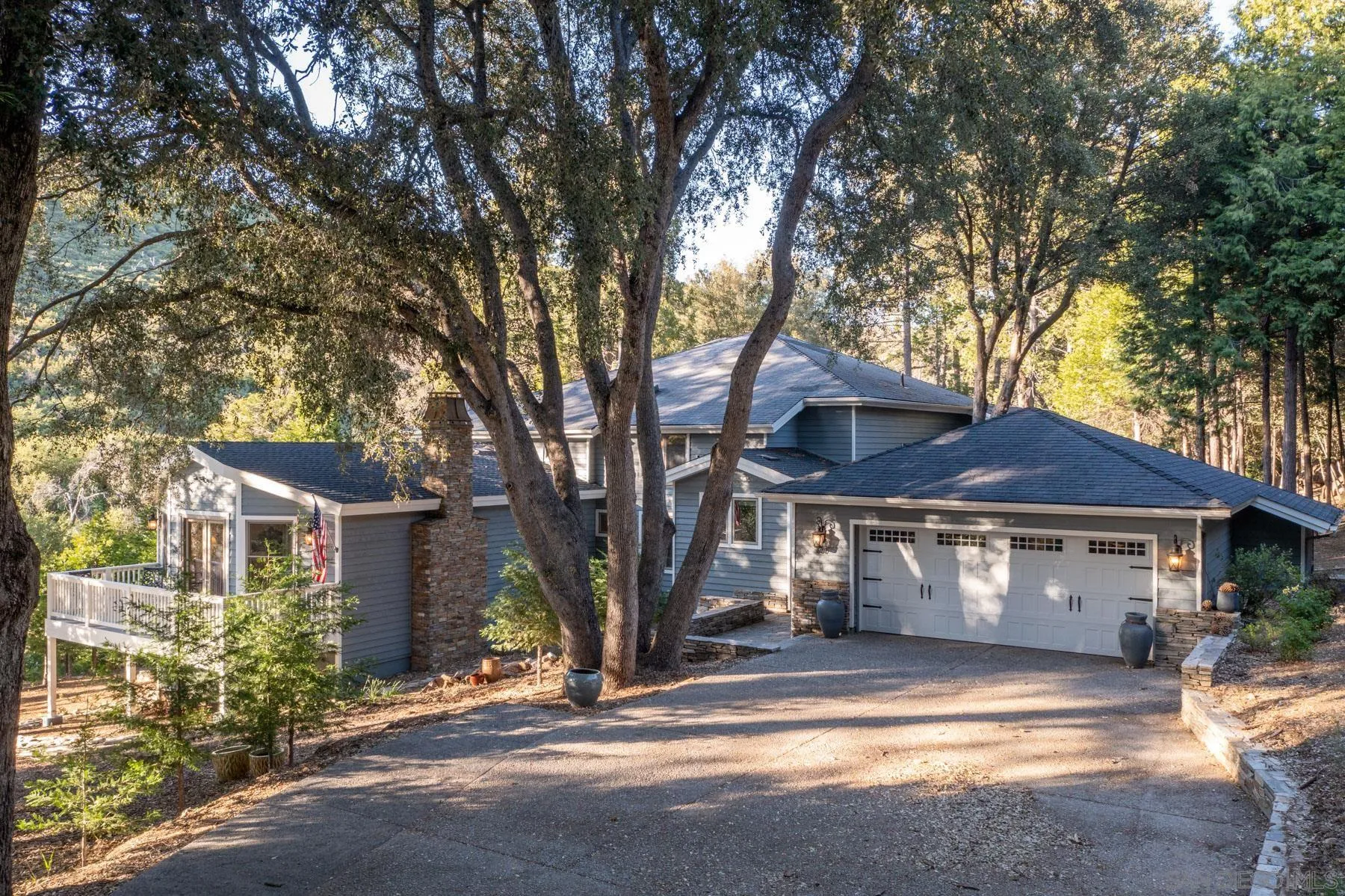 880 East Incense Cedar Road Julian, CA 92036 - Photo 1 of 1 a front view of a house with a garden and trees