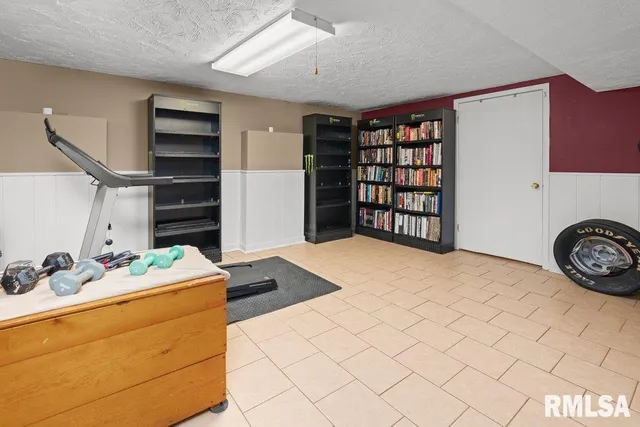 a room with a baby crib and a dresser